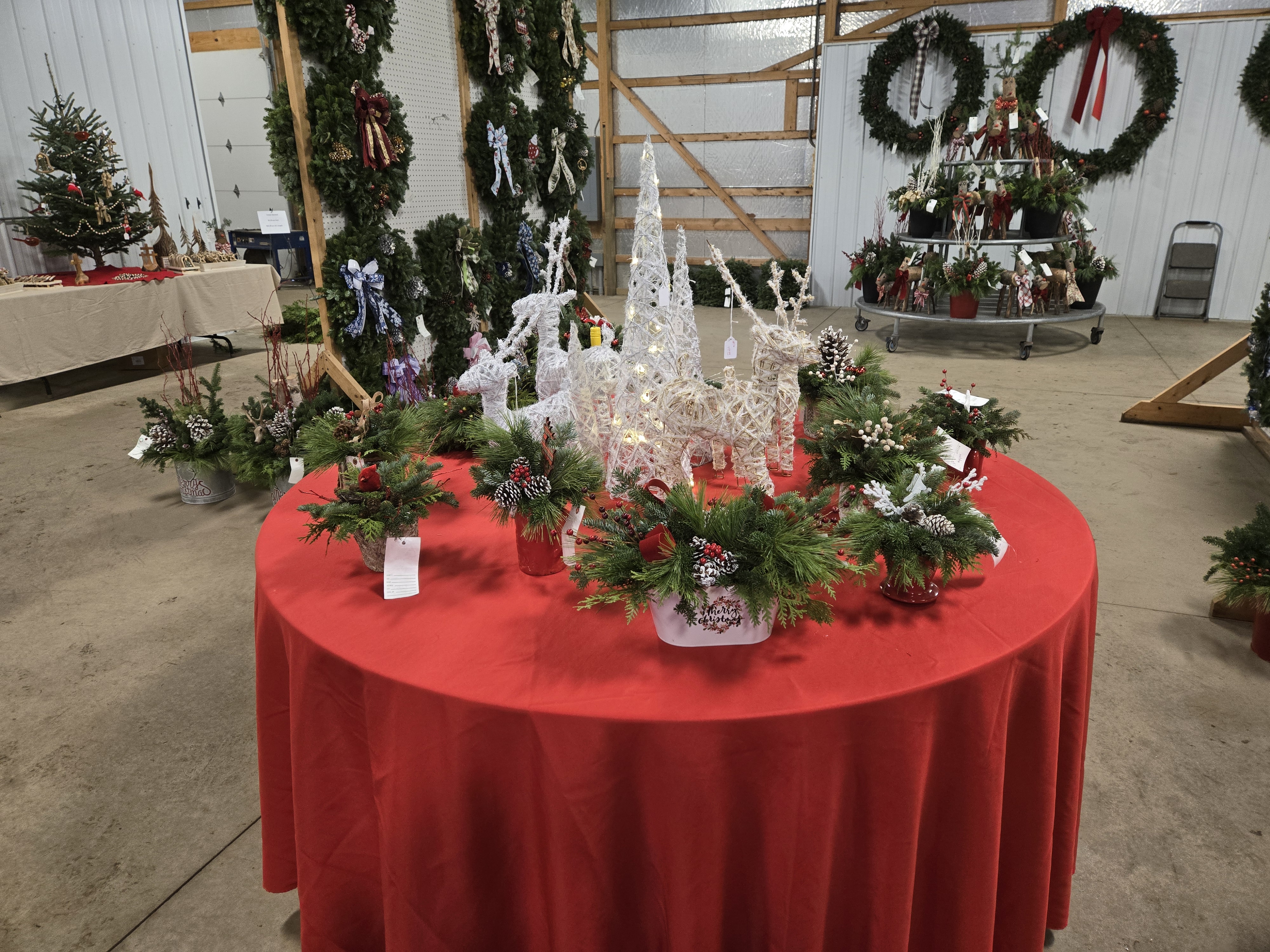 Christmas centerpieces and décor on display at a garden center.